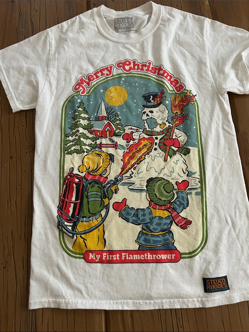 Steven Rhodes "My First Flamethrower" Holiday Graphic Tee - White